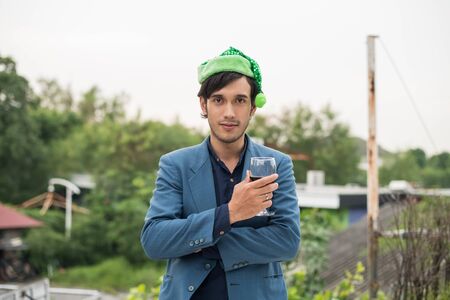 Young people holding glass talk in the party.の写真素材
