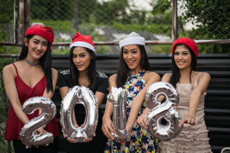 Young people holding glass talk in the party.の写真素材