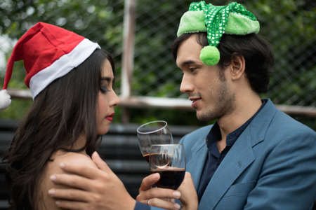 Young people holding glass talk in the party.の写真素材