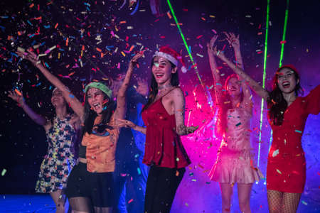 Young people are celebrating the party at the concert.の写真素材