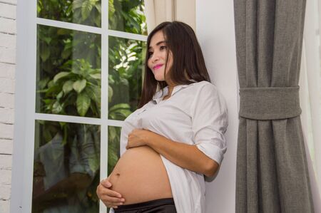 Abdominal women are doing activities within the home.
