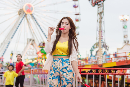 Beautiful women are happy in the amusement park.の写真素材