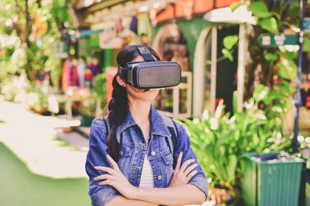 Beautiful girl feeling from wearing VR box.