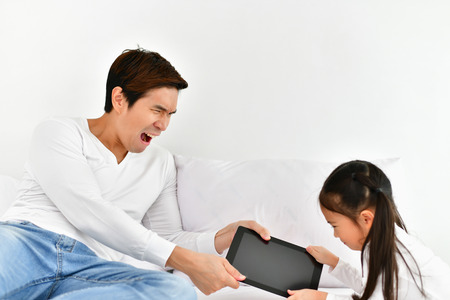 Family members are refusing to use the phone.の写真素材