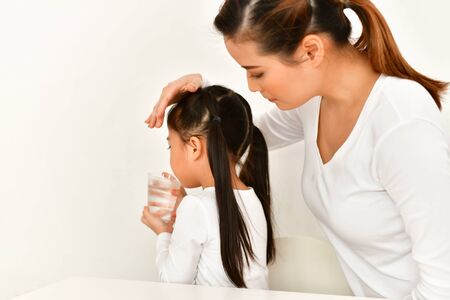 Girl wake up to drink water in the morning.の写真素材