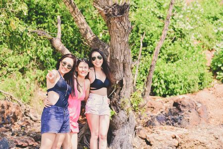 Beautiful woman wearing a swimsuit playing in the beach.の写真素材