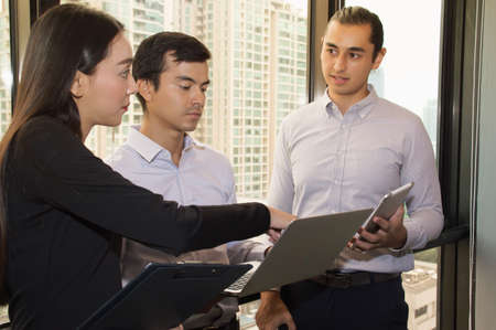 Businessmen are working diligently in the office.の写真素材