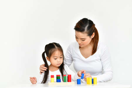 Parents are teaching children to do homework.の写真素材