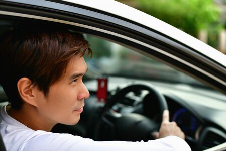 Parents and Daughters are driving safely on a safe route.の写真素材