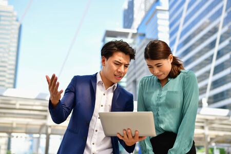 Businessmen are blaming the work of their followers.の写真素材