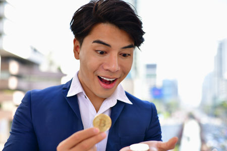 Businessmen succeed in and earn from bitcoin.の写真素材