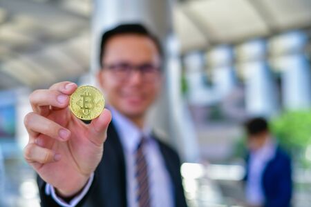 Businessmen succeed in and earn from bitcoin.の写真素材