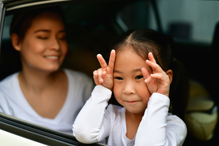 Parents and Daughters are driving safely on a safe route.の写真素材