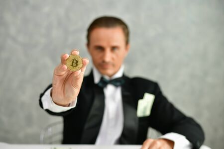 Concept Very wealthy businessman. Businessman is happy with his money.A businessman showing his...
