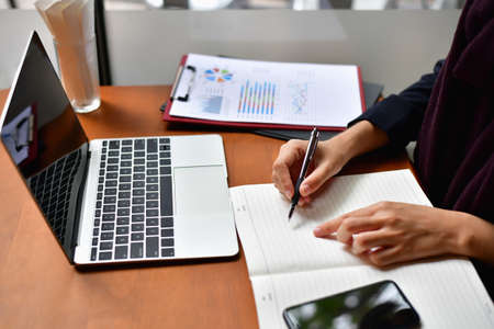 Business Concept.Young Asian businesswoman is working happily.Young businesswoman working in a...