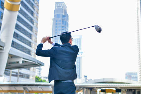 Concept Business people playing sports, Businessmen play golf to relax.の写真素材