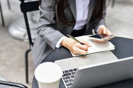Business Concept.Young Asian businesswoman is working happily.Young businesswoman working in a...