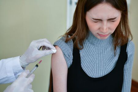 Terrible medical concept. Patients are afraid to go to the doctor. Patients afraid of injection. Patients do not like syringes. Patients fear and anxiety.の写真素材