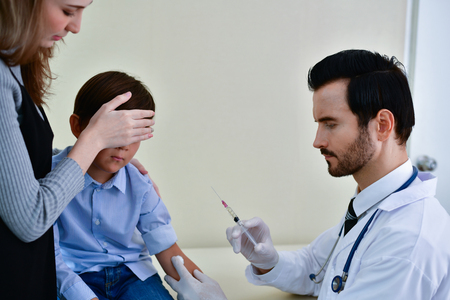 Terrible medical concept. Patients are afraid to go to the doctor. Patients afraid of injection. Patients do not like syringes. Patients fear and anxiety.の写真素材