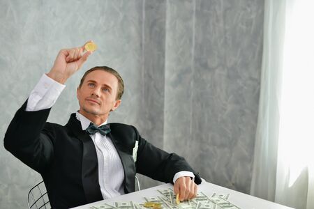 Concept Very wealthy businessman. Businessman is happy with his money.A businessman showing his money.の写真素材