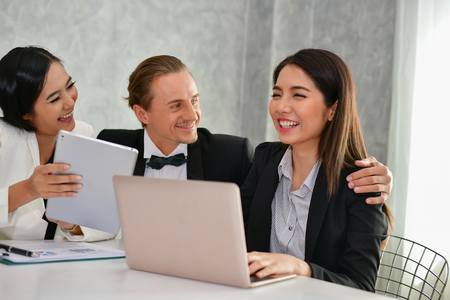 Business Concepts. Businessman is working in office. Business People work happily and relax. The businessmen are serious. Businessmen, they talk and communicate.の写真素材