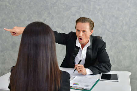 Business Concepts. Businesspeople is working in office. The Business people are serious. Businessmen, they talk and communicate. Business people work seriously in the office.の写真素材