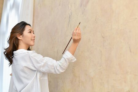Concept Artist Beautiful girl. Beautiful women are creating art. Beautiful woman is painting...