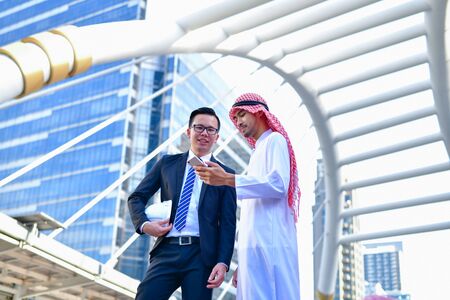Arab Business Concepts, Arab business people are working in the business district. Businessmen are meeting outside. Business people are working happily.の写真素材