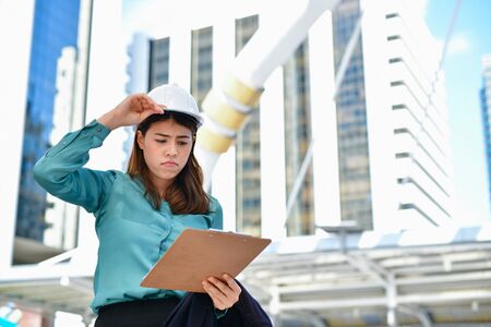 Concepts Business Engineering Stress, The engineer worked unhappily, Young Business people are tense with the job.の写真素材