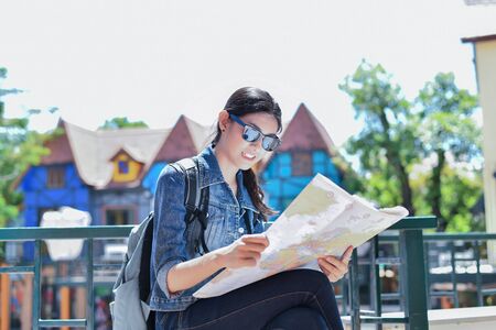Travel and relaxing Concepts, Tourists are taking photos in the city. Asian girls are happily traveling. Beautiful girl is relaxing Travel. Asian girls are traveling in Asia.の写真素材