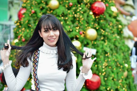 Christmas and New Year Concept, Beautiful girls are happy to celebrate Christmas and New Year. Asian women are very happy on New Year's Eve.の写真素材