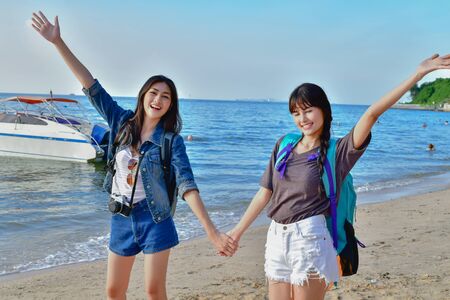 Travel Concepts. Beautiful girl relaxing on the beach. Beautiful girl is happy to come to the beach. Beautiful girl is walking the beach. Happy women and relaxing on the seashore.の写真素材