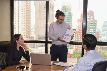 Business Concepts. Businessman is working in office. Business People work happily and relax. The businessmen are serious. Businessmen, they talk and communicate.の写真素材