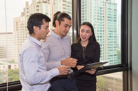 Business Concepts. Businessman is working in office. Business People work happily and relax. The businessmen are serious. Businessmen, they talk and communicate.の写真素材