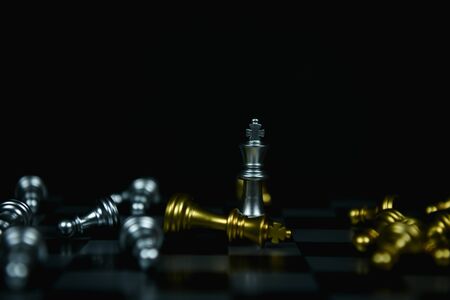 Leadership Concepts. Chess is a leader.  Comparing chess is a strategic business plan. Businessman is playing chess. Chess game on a black background.の写真素材