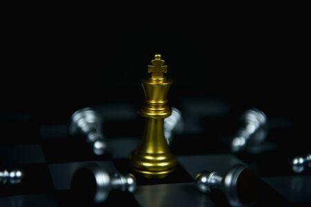 Leadership Concepts. Chess is a leader.  Comparing chess is a strategic business plan. Businessman is playing chess. Chess game on a black background.の写真素材
