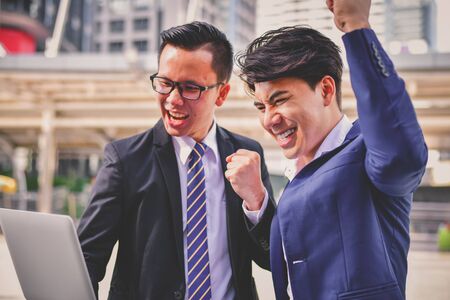 Business Concept Contact, Young business men are happy to work in the city.の写真素材