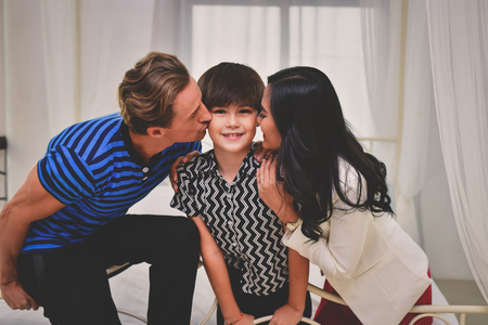 Family Concept. Family is happy in the house. Family is doing activities in the bedroom. The family loves each other happily.の写真素材