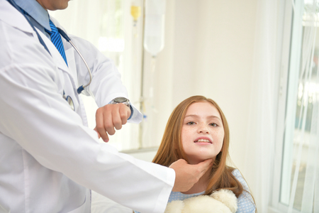 Health Concepts. The doctor is examining the health of the child. The doctor is talking to the patient. Children are happy in the hospital.の写真素材