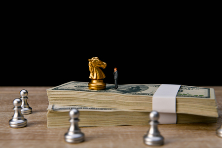 Leadership Concepts. Chess is a leader.  Comparing chess is a strategic business plan. Businessman is playing chess. Chess game on a black background.の写真素材