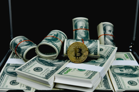 Finance Business Concepts. Lots of money on a black background. Investments are a necessity of business. Businessman looking at a lot of money.の写真素材