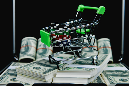 Gambling Concepts. Businessmen are gambling in the casino. Betting is a gamble for investors. Businessmen are playing card games on a black background.の写真素材