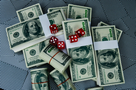 Gambling Concepts. Businessmen are gambling in the casino. Betting is a gamble for investors. Businessmen are playing card games on a black background.の写真素材