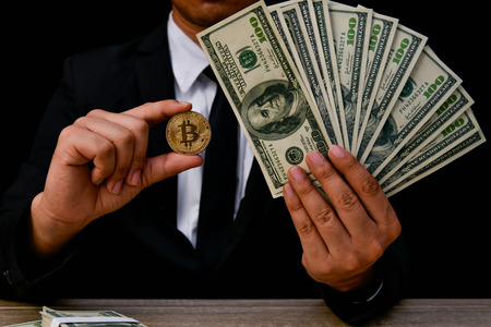 Finance Business Concepts. Lots of money on a black background. Investments are a necessity of...