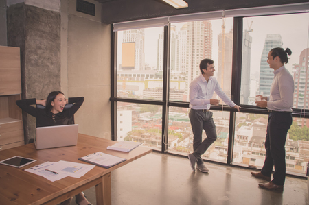 Business Concepts. Businessman is working in office. Business People work happily and relax. The businessmen are serious. Businessmen, they talk and communicate.の写真素材
