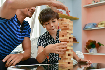 Family Concept. Family is happy in the house. Dad and son are playing fun at home.の写真素材