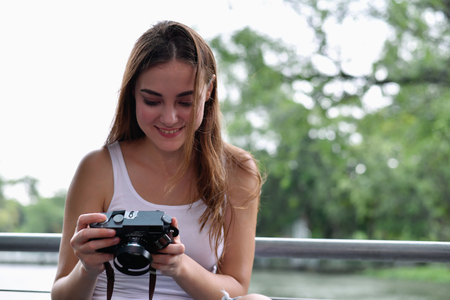 Travel concept. beautiful girls are traveling in the woods.  Beautiful women are taking photos in the forest.の写真素材