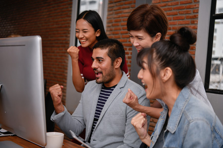 Business concept. Businessmen are shouting with joy. Business people are raising their hands for...