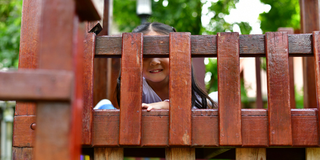 The girl is playing in the park.の写真素材