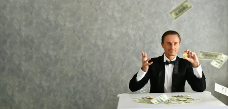 Concept Very wealthy businessman. Businessman is happy with his money.A businessman showing his money.の写真素材